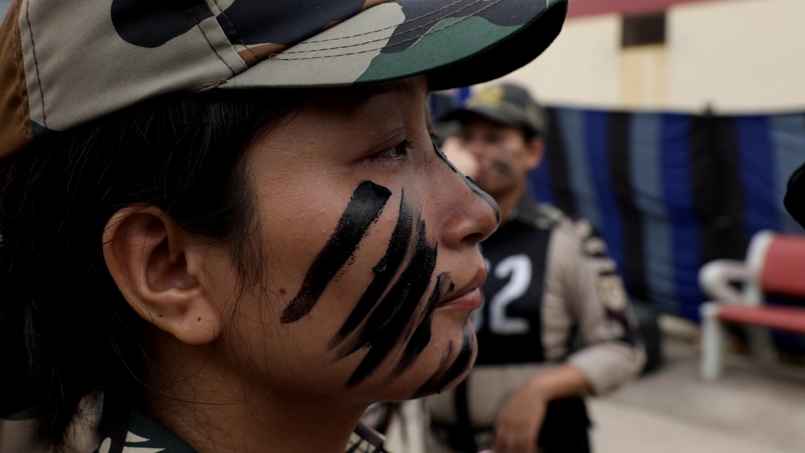 Officer in tactical face paint during a Delhi Police training exercise